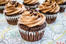 a chocolate cupcake topped with chocolate icing